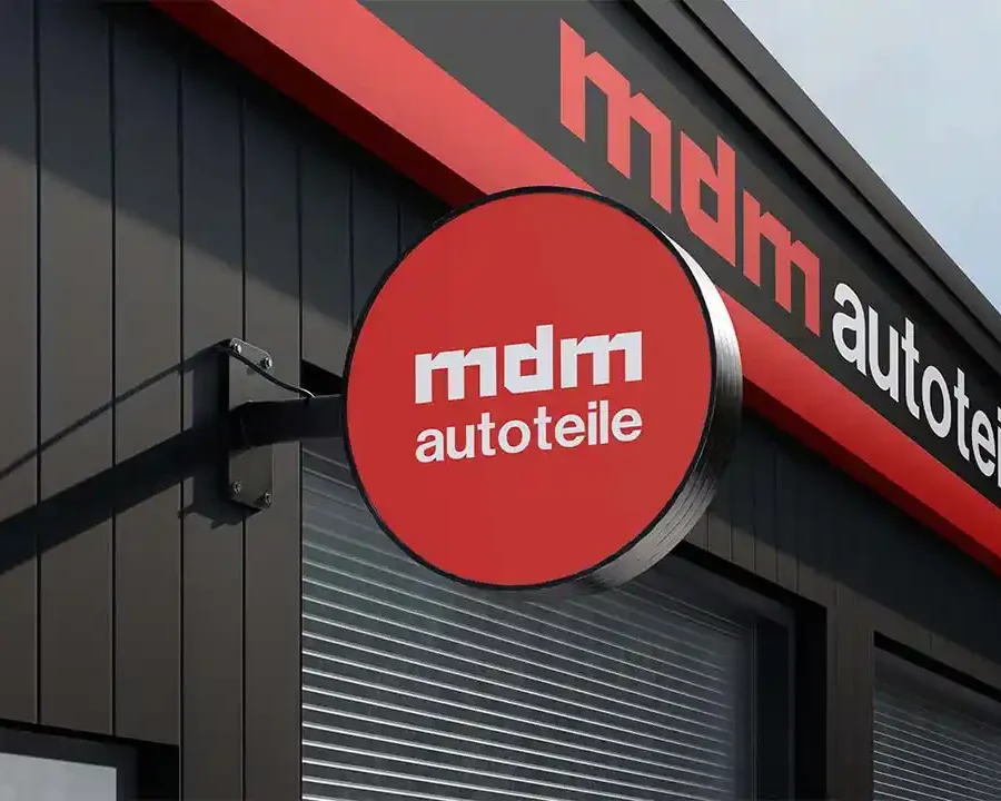 mdm Autoteile automotive brand identity applied to storefront signage