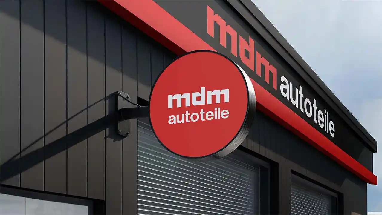 mdm Autoteile automotive brand identity applied to storefront signage